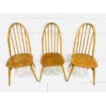 Three Ercol high back Windsor chairs.