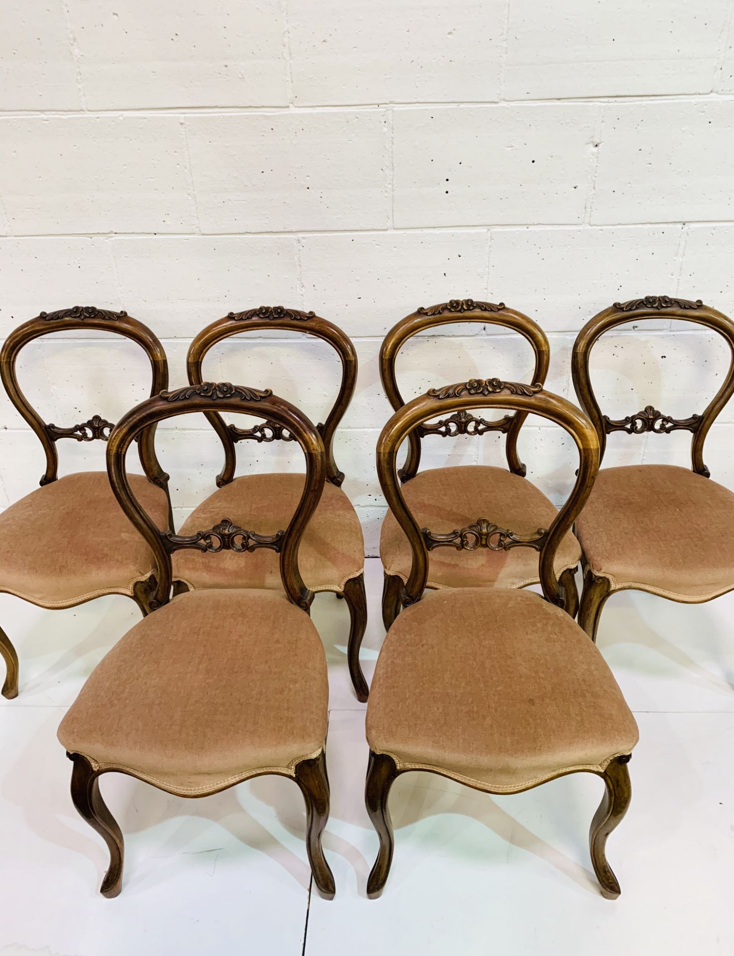 Set of six mahogany balloon back dining chairs with pink upholstered seats and carved top rail. - Image 2 of 4
