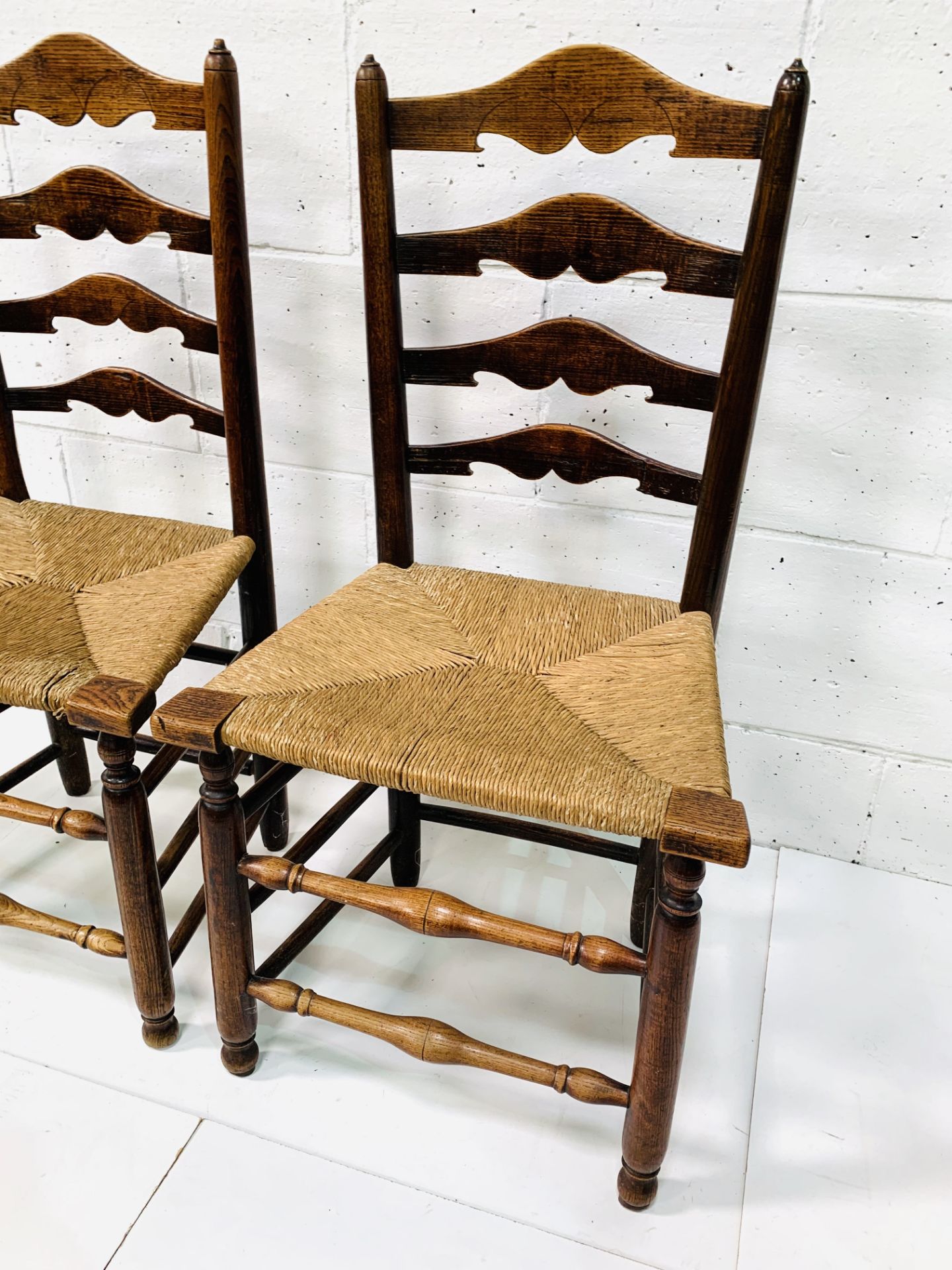 Two oak framed ladder back chairs with string seats. - Image 4 of 6