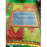 Hand knotted carpet with coloured panels.