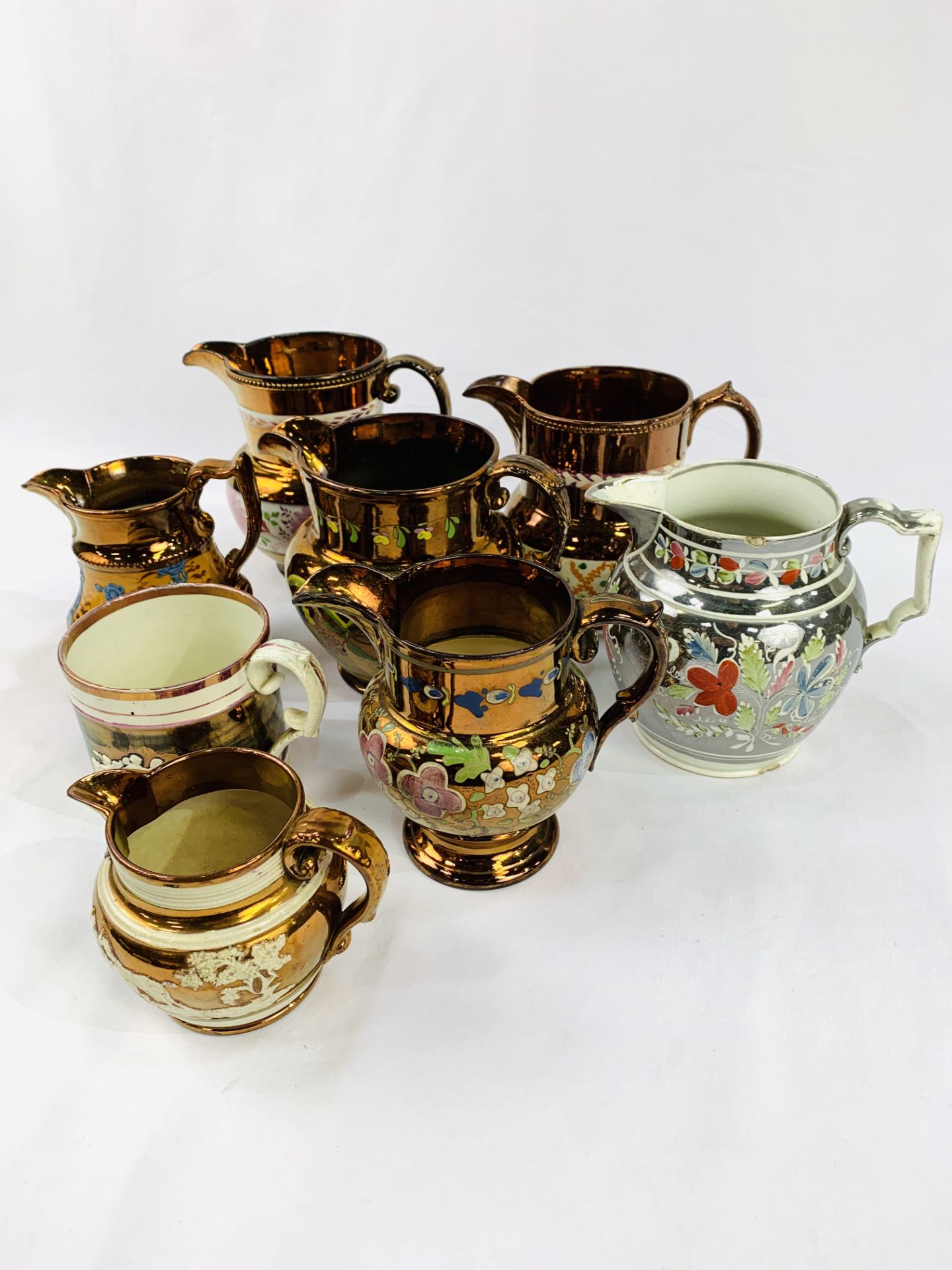 Seven lustre ware jugs and a lustre ware tankard. - Image 2 of 3