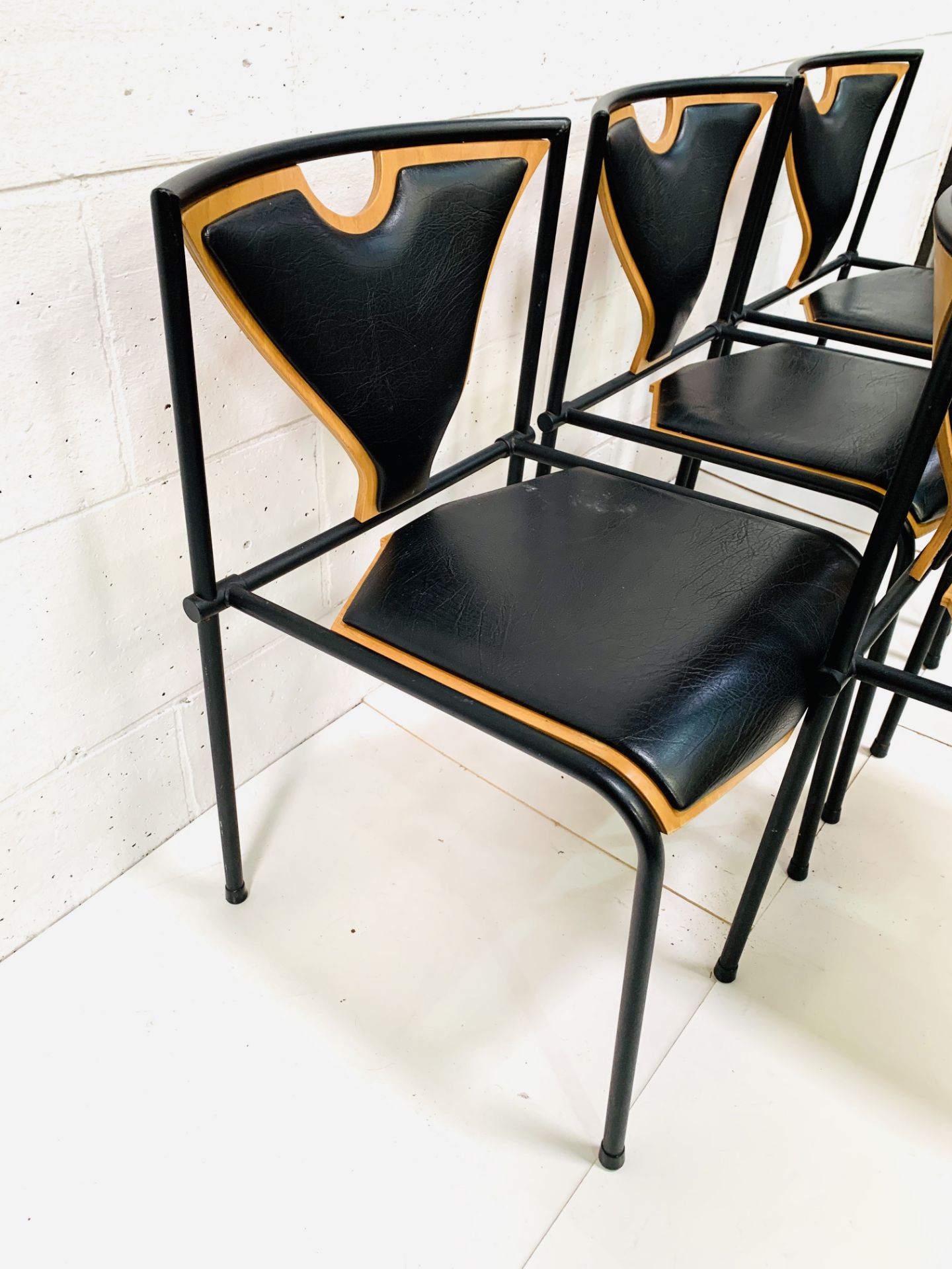 Five 'Novell' black metal framed vinyl and plywood chairs by EH Furniture, Denmark - Image 5 of 5