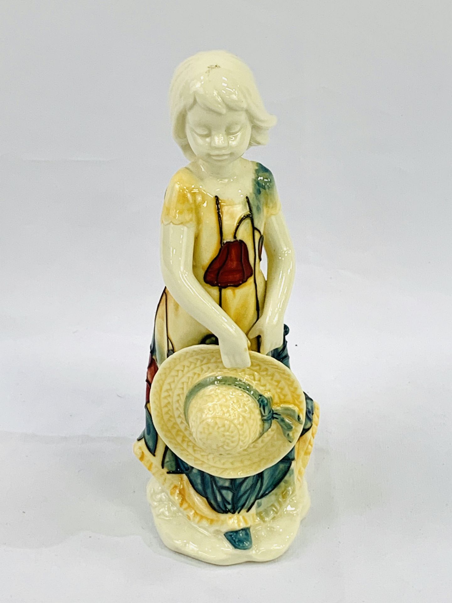 Boxed Tupton ware figure of a young girl.