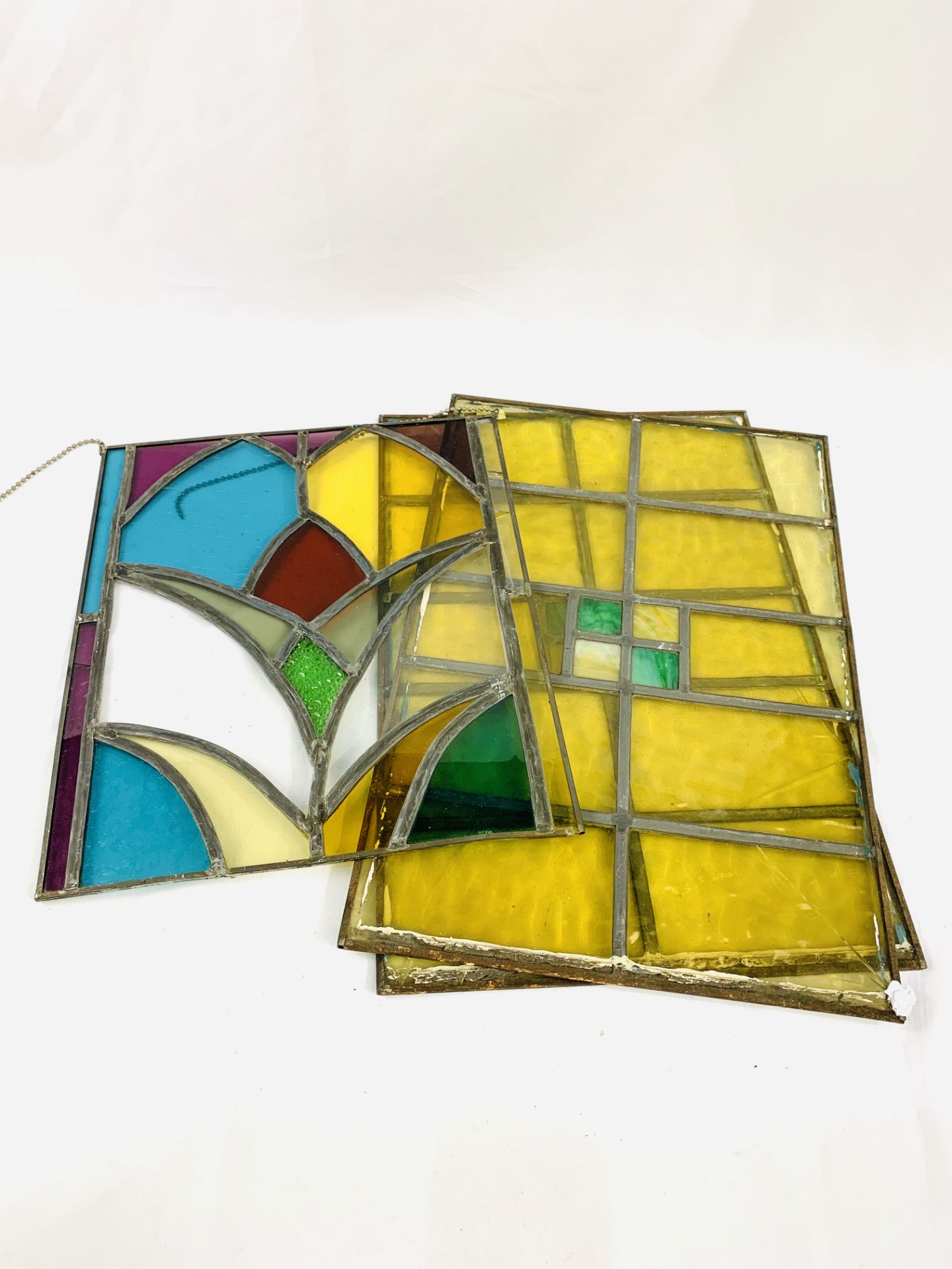 3 Antique stained glass window panels.