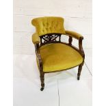 Mahogany yellow buttoned velvet upholstered open arm chair with decorative splat.