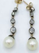 Pearl and diamond drop earrings . Approx length 36mms. Wt. 4.8gms.