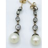 Pearl and diamond drop earrings . Approx length 36mms. Wt. 4.8gms.