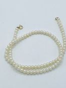 Yellow gold clasp freshwater pearl necklace length 42cms