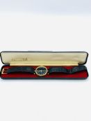 Gucci gold plated and black wrist watch with original strap