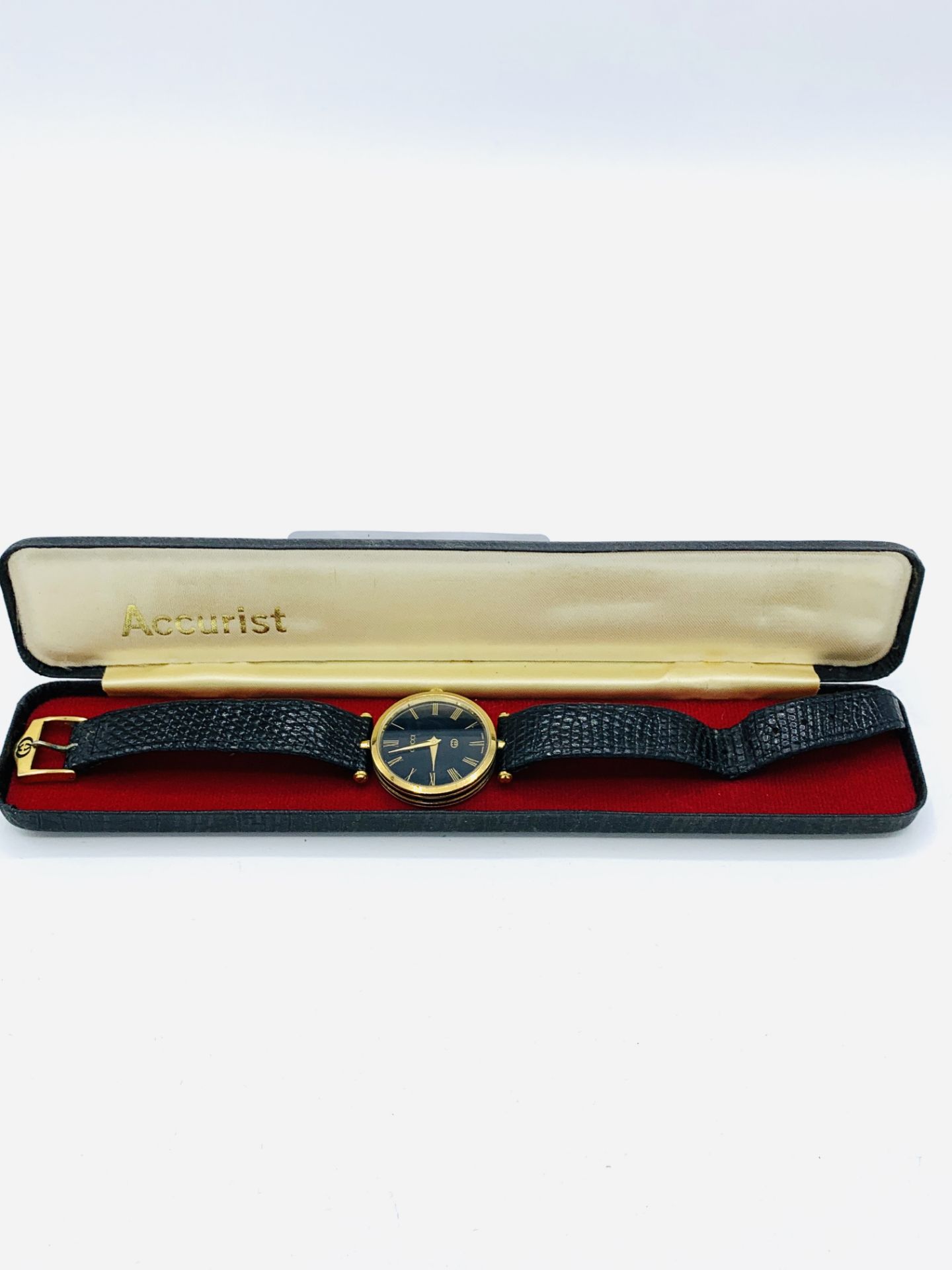 Gucci gold plated and black wrist watch with original strap