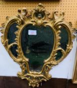 Georgian wall mirror with ornately carved gilt plaster frame