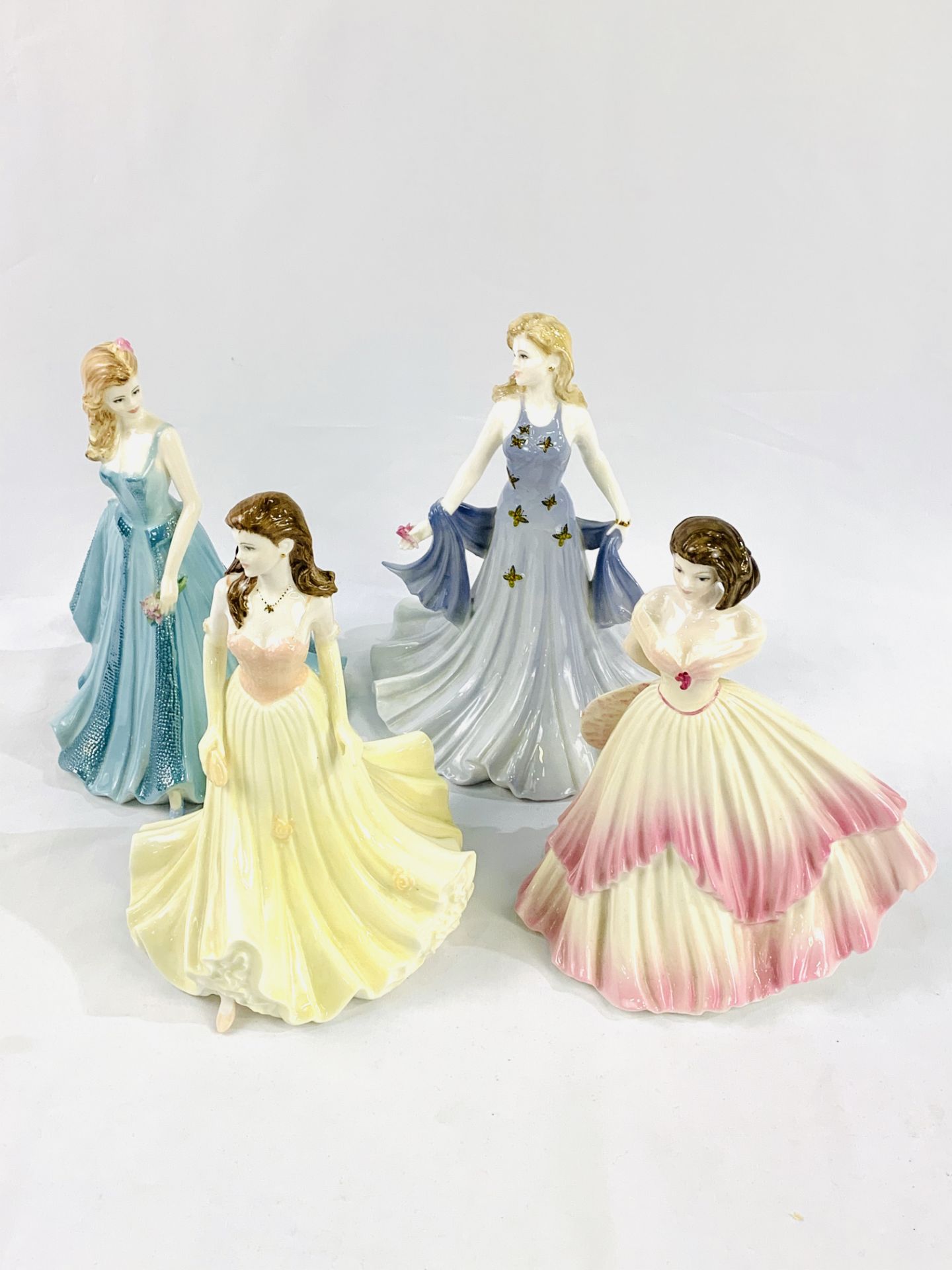 4 Coalport 'Ladies of Fashion' figurines.