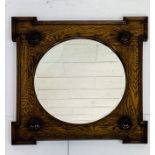 Early 20th Century circular bevelled edge wall mirror, square oak frame with a boss to each corner.