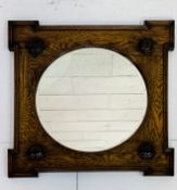 Early 20th Century circular bevelled edge wall mirror, square oak frame with a boss to each corner.