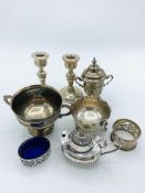 A pair of small silver candlesticks, 2 silver trophies, and silver cruets