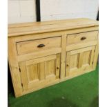 Antique pine sideboard with two drawers over two cupboards.