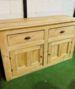 Antique pine sideboard with two drawers over two cupboards.