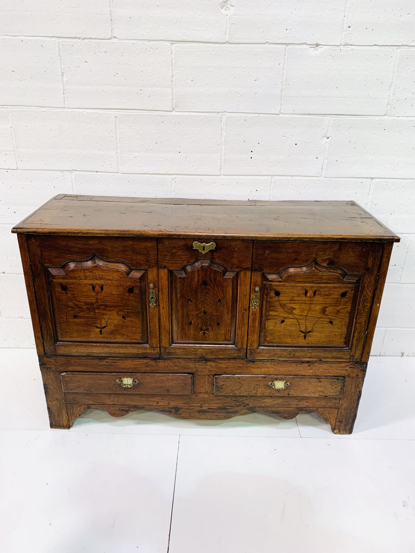 Oak sideboard with decorative inlaid door fronts and panel