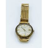 Garrard 9ct gold case wrist watch, going