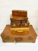 Large leather suitcase; and other leather cases