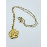 9k gold flower pendant and necklace.