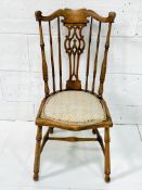 Elm framed rail back chair with carved splat.