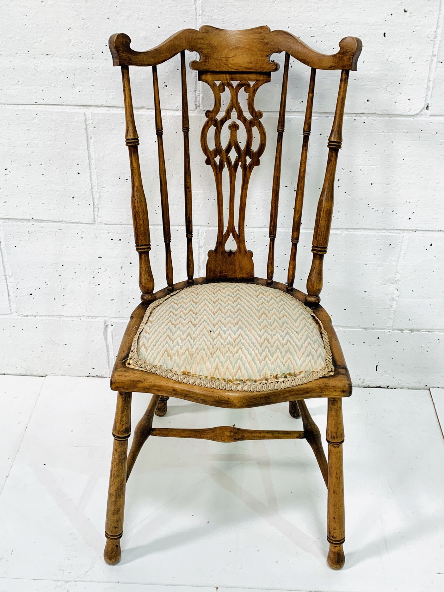 Elm framed rail back chair with carved splat.