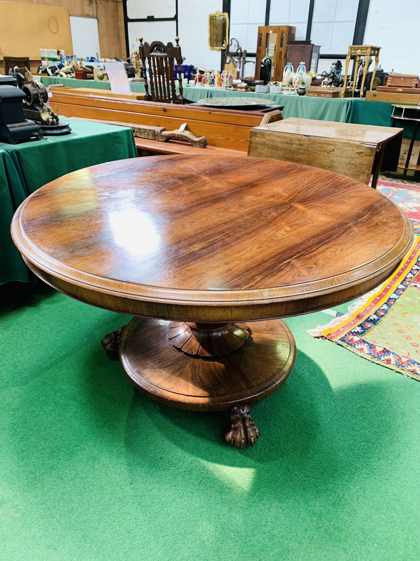 Rosewood circular tilt top table on substantial rosewood pedestal