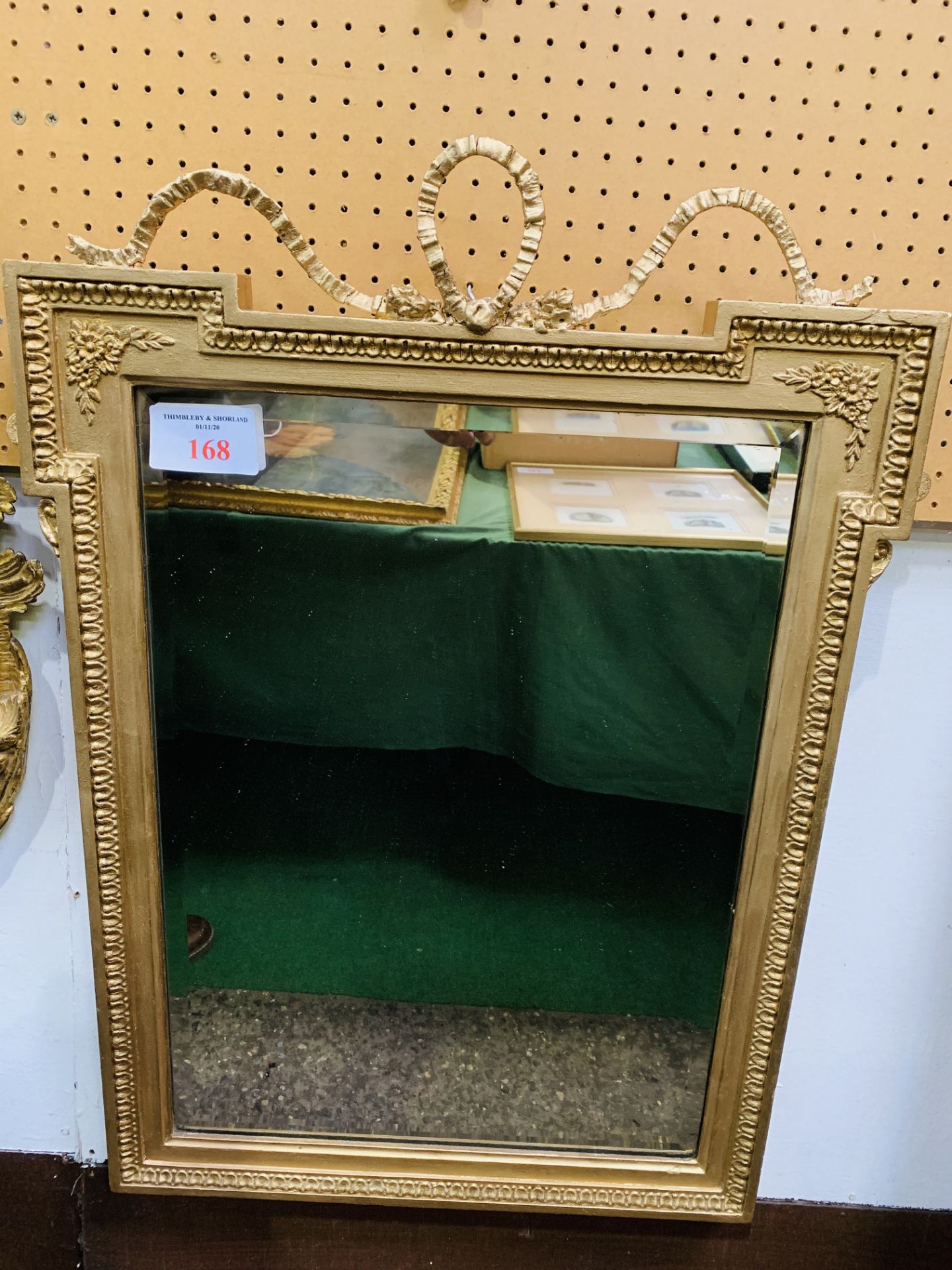 Victorian ‘T' frame & ribbon top mirror with bevelled glass, 72 x 52 cm, painted gold.