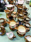 A collection of 19 lustre ware jugs.