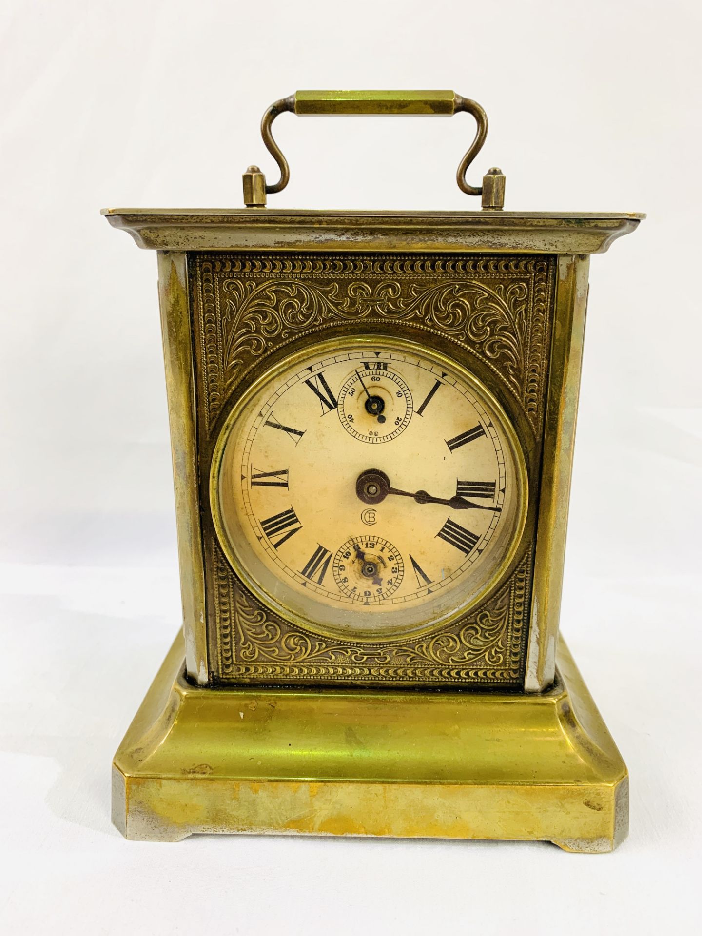 Gilded musical carriage clock with secondary dials and musical alarm.