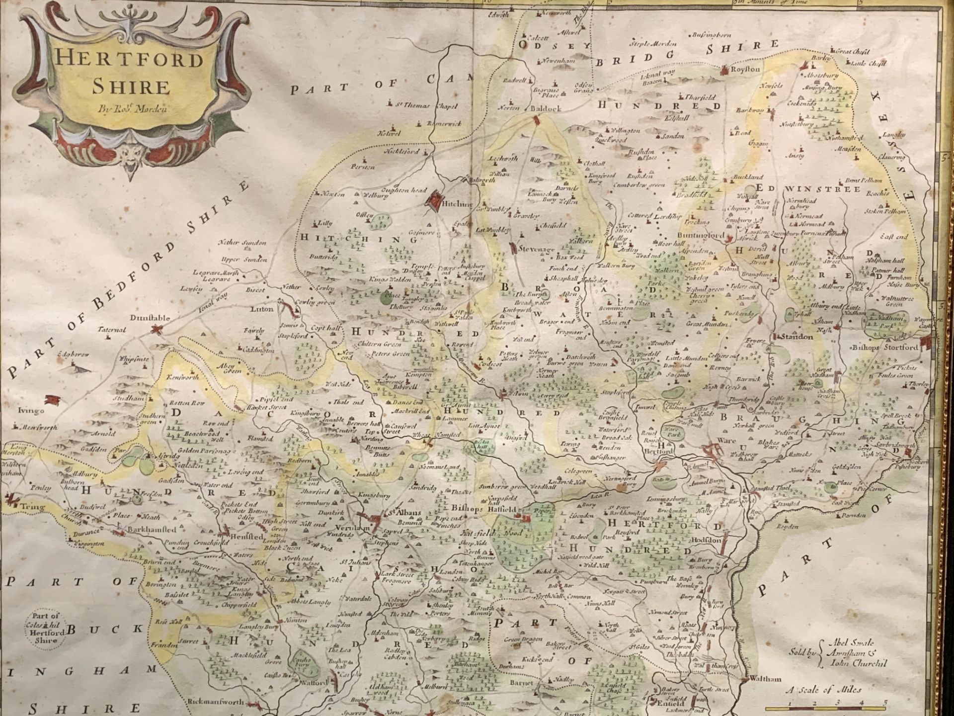 Framed and glazed engraved hand coloured map of Hertfordshire by Robert Morden.