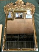 Gilt framed mirror with carved pediment