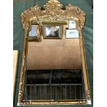 Gilt framed mirror with carved pediment