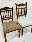 Two mahogany framed Edwardian rail back chairs with upholstered seats.