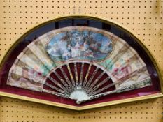 18th Century hand painted paper fan on gilded decoated bone frame, in display case.