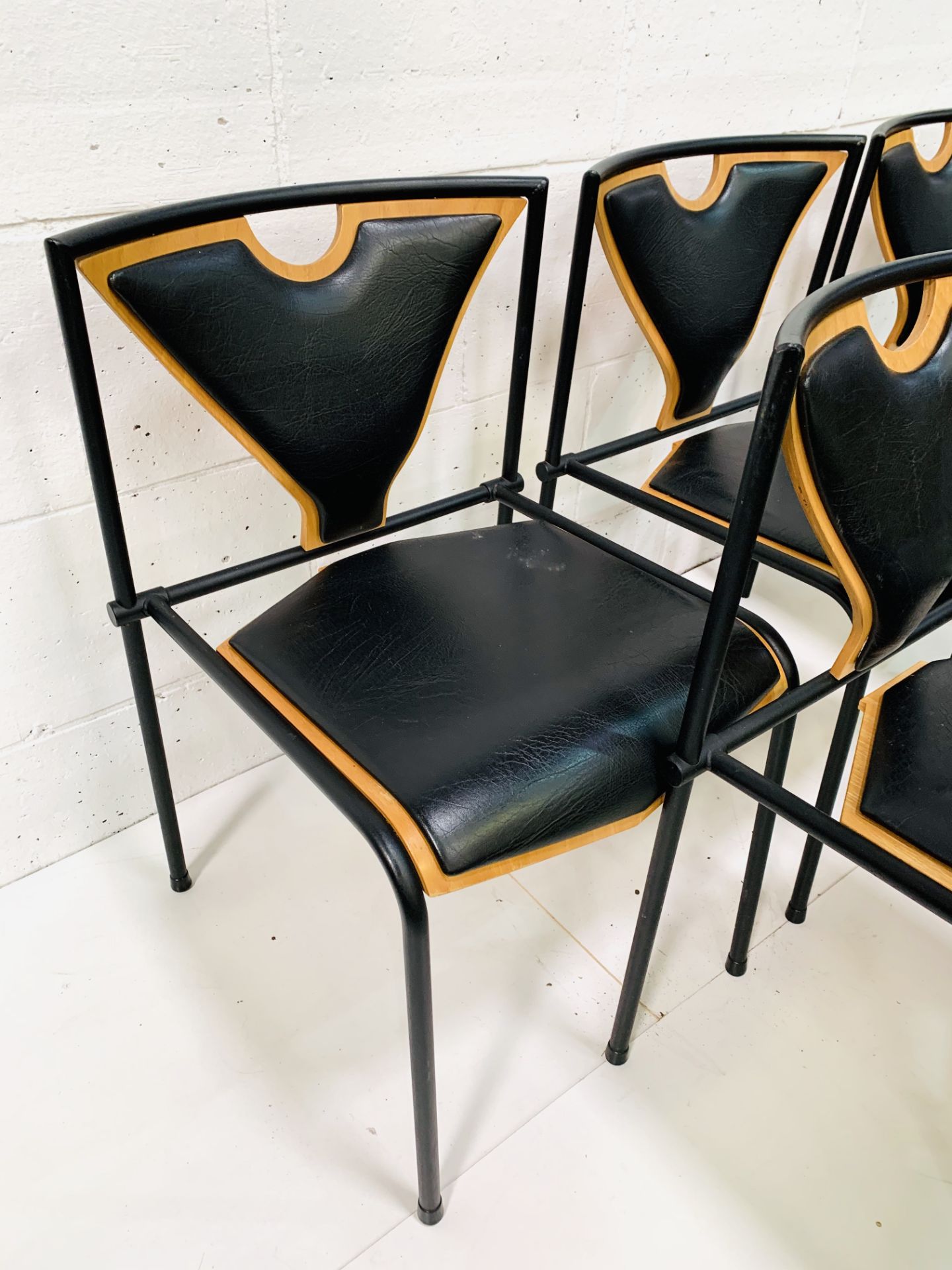 Five 'Novell' black metal framed vinyl and plywood chairs by EH Furniture, Denmark - Image 4 of 5