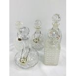Five cut glass decanters.
