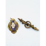 Victorian 9ct gold and ruby bar brooch, and a yellow metal and enamel pendant