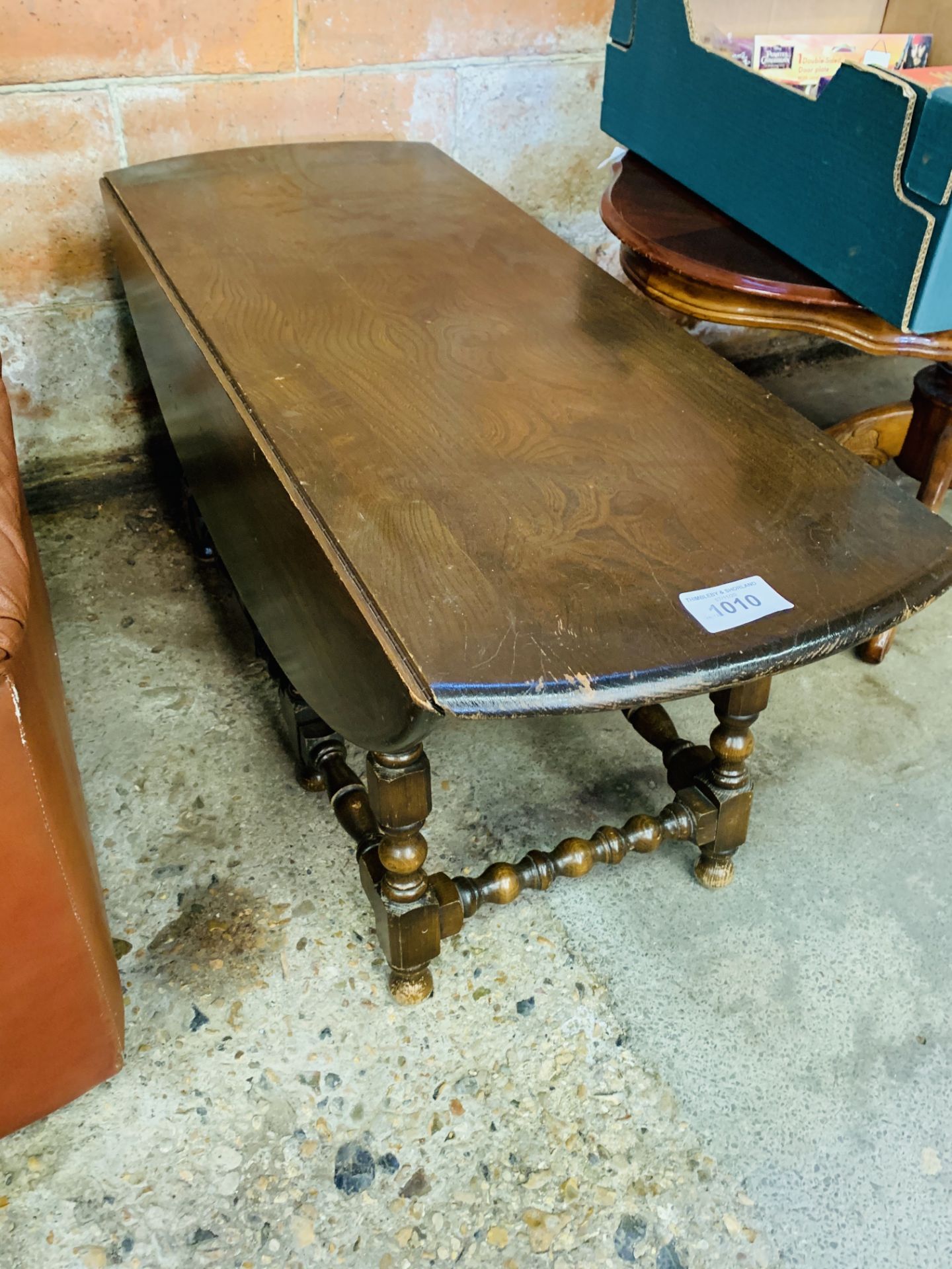 Ercol style low drop side gate legged table.