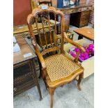 Reproduction French style open armchair with cane seat.