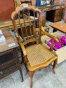 Reproduction French style open armchair with cane seat.