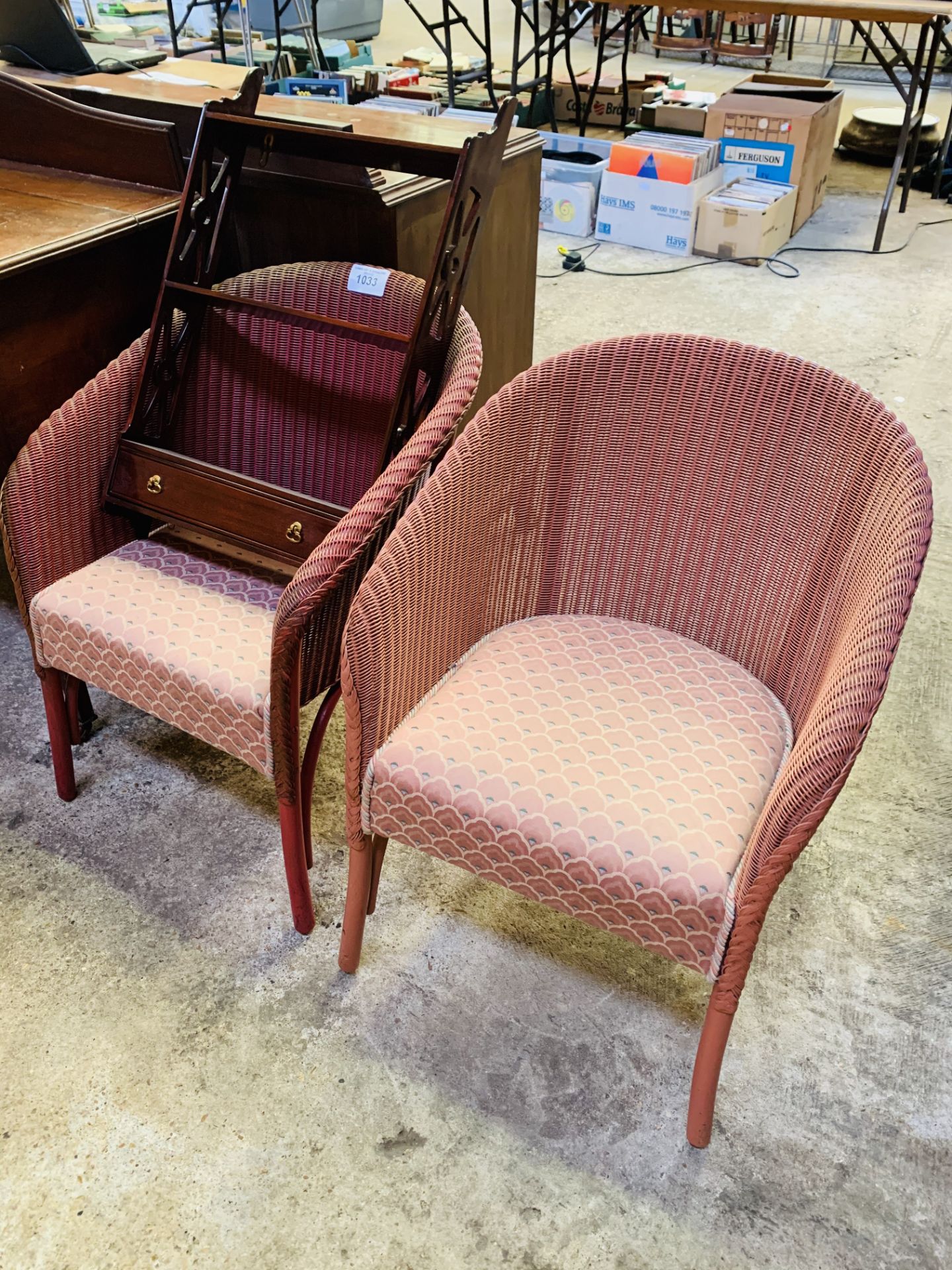 Pair of Lloyd Loom chairs with upholstered seats.