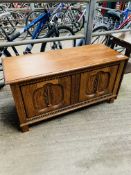 Carved oak chest together with a mahogany plant table.