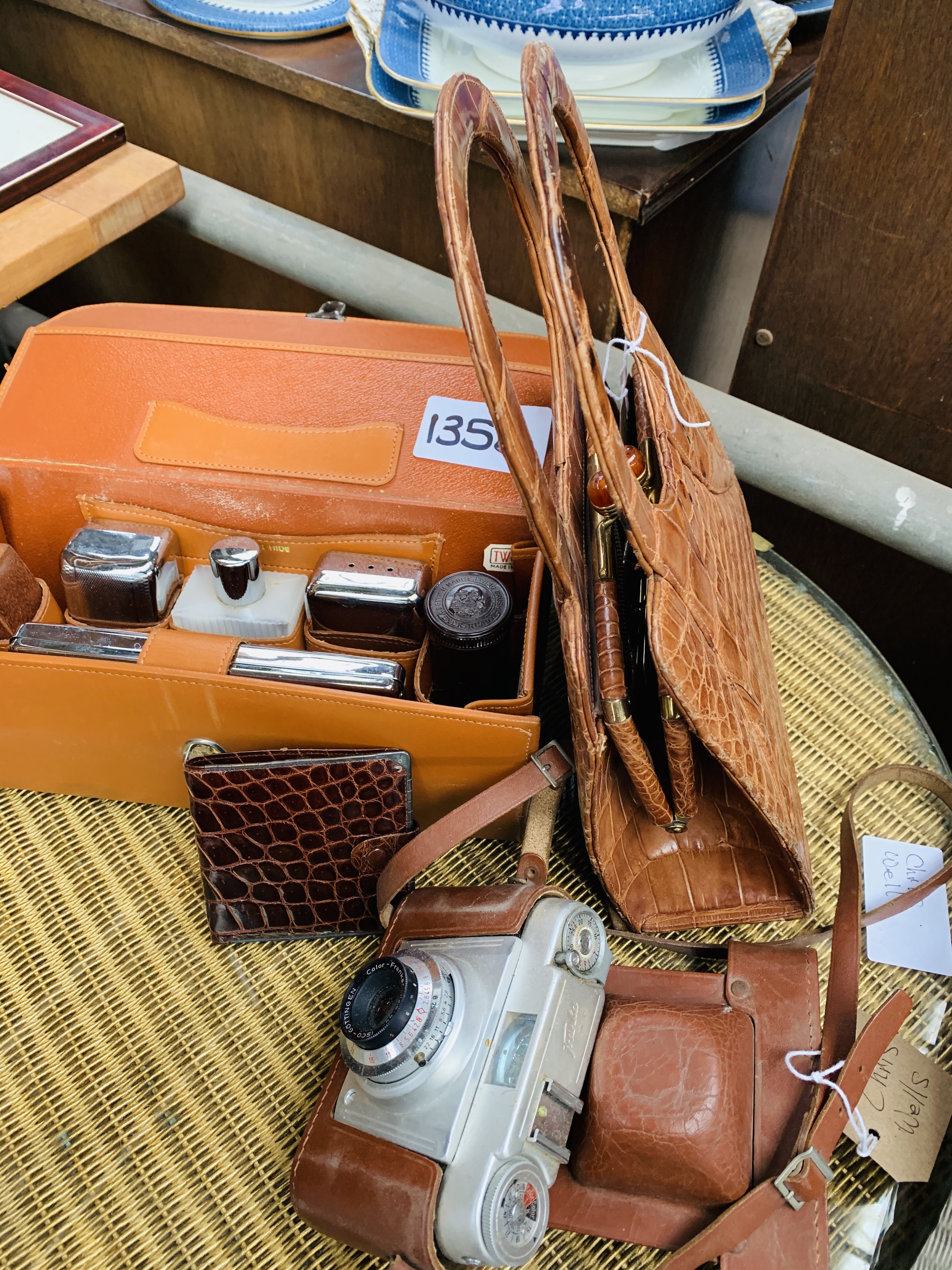 1950's handbag, crocodile skin wallet with silver trim, travelling toilet case and a Franka camera.