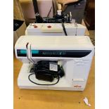 Elna 3003 electric sewing machine with one other machine.