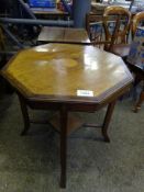 Mahogany octagonal top display table, together with a mahogany sewing box.