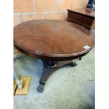 Mahogany circular tilt top dining table.