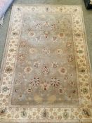 Chinese olive ground carpet 175 x 114cms.