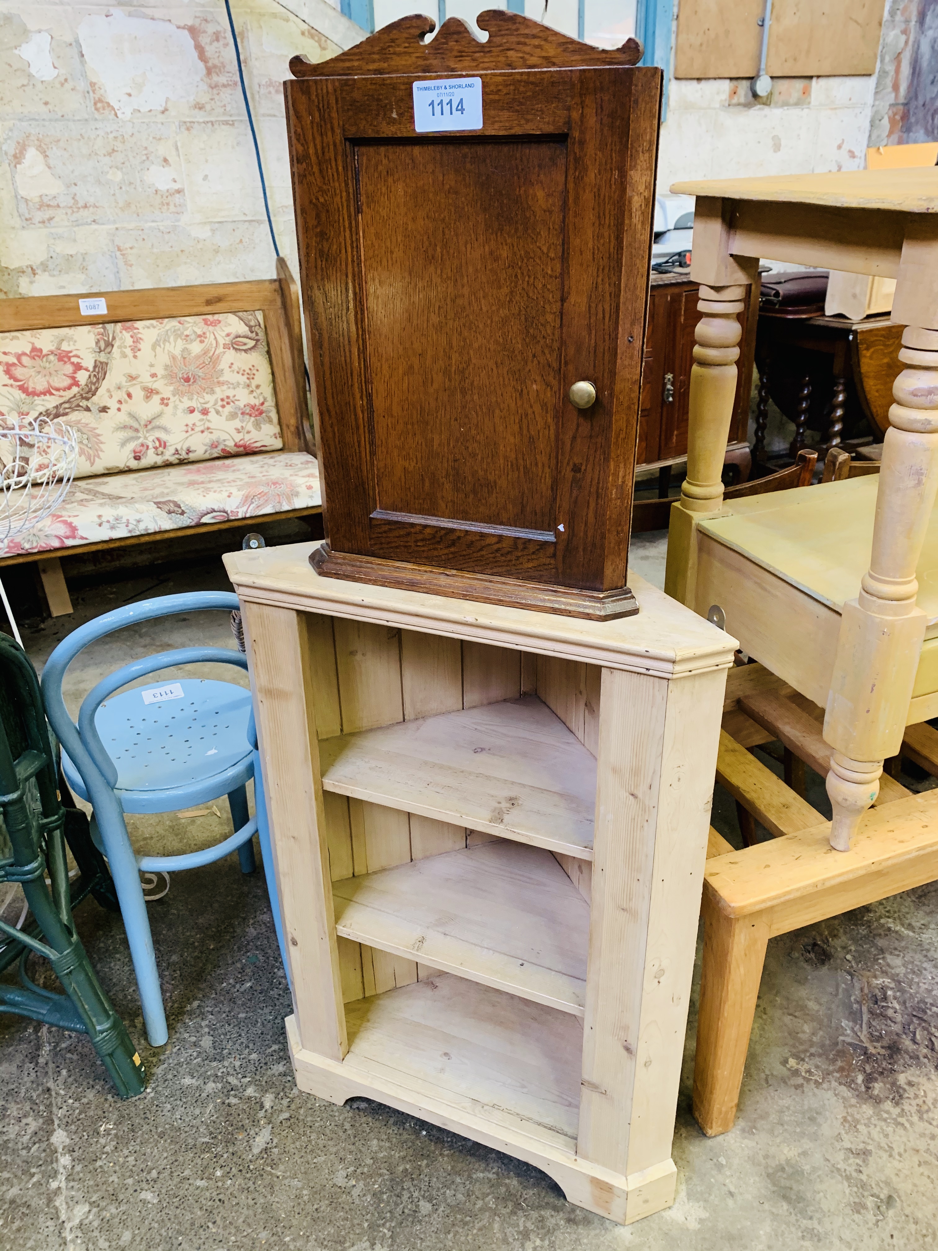 Pine three shelf corner unit, and an oak corner wall mounted cupboard.